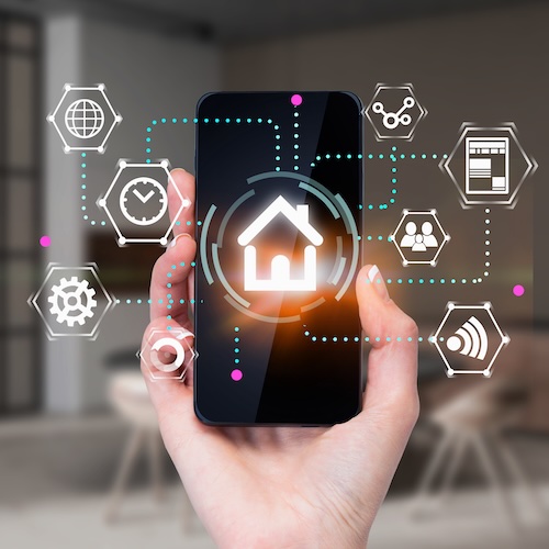 Woman showing the capabilities of her smart home wiring on her phone