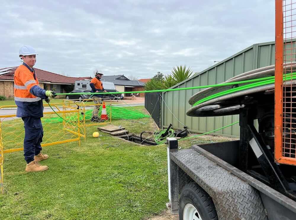 DeltaPrime installers running cable during an NBN installation in Perth